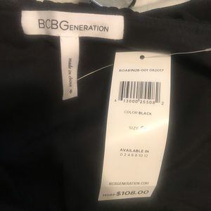 Black faux leather bottom. Strapless dress. New